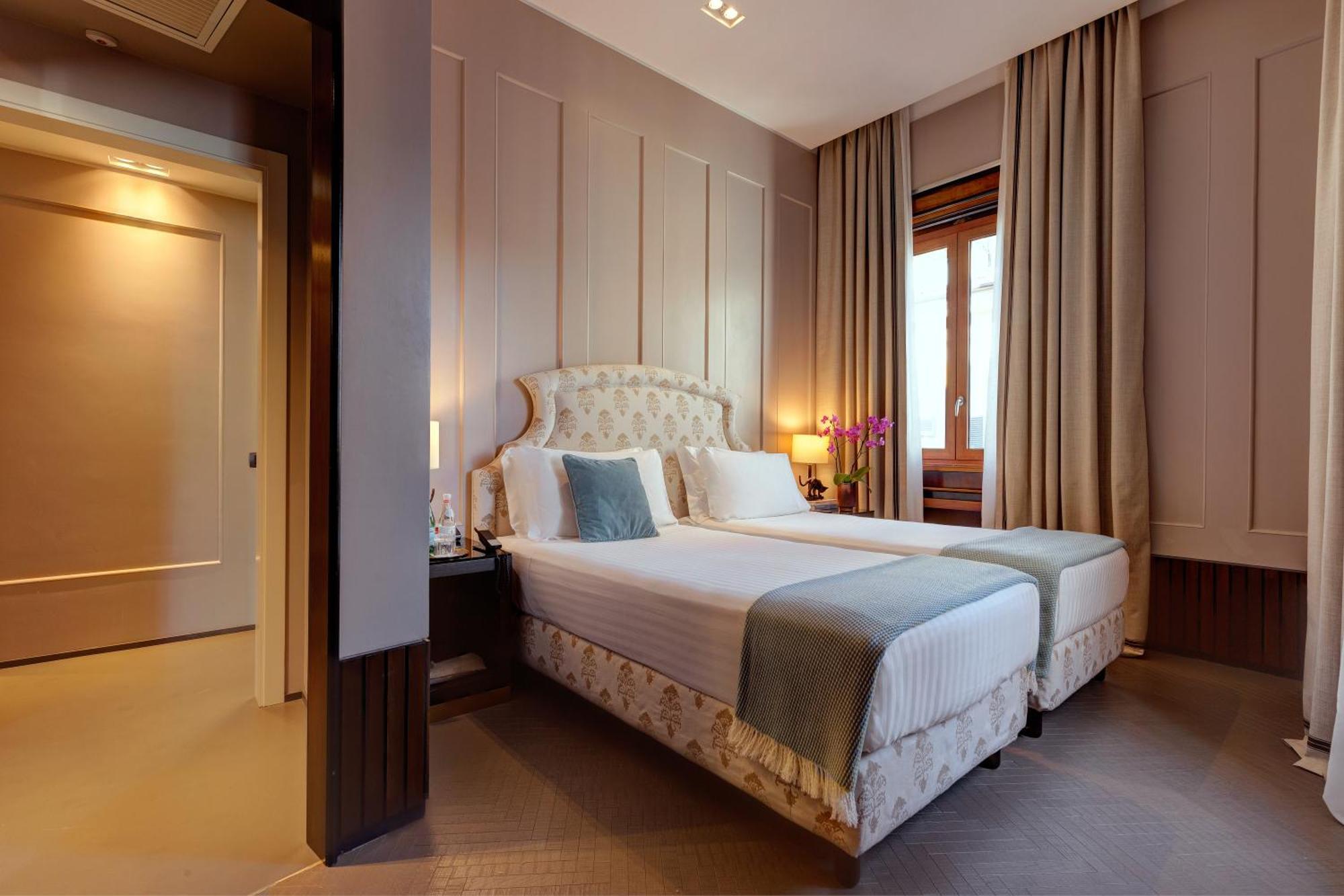 Quarto família deluxe de 2 quartos com cama king-size