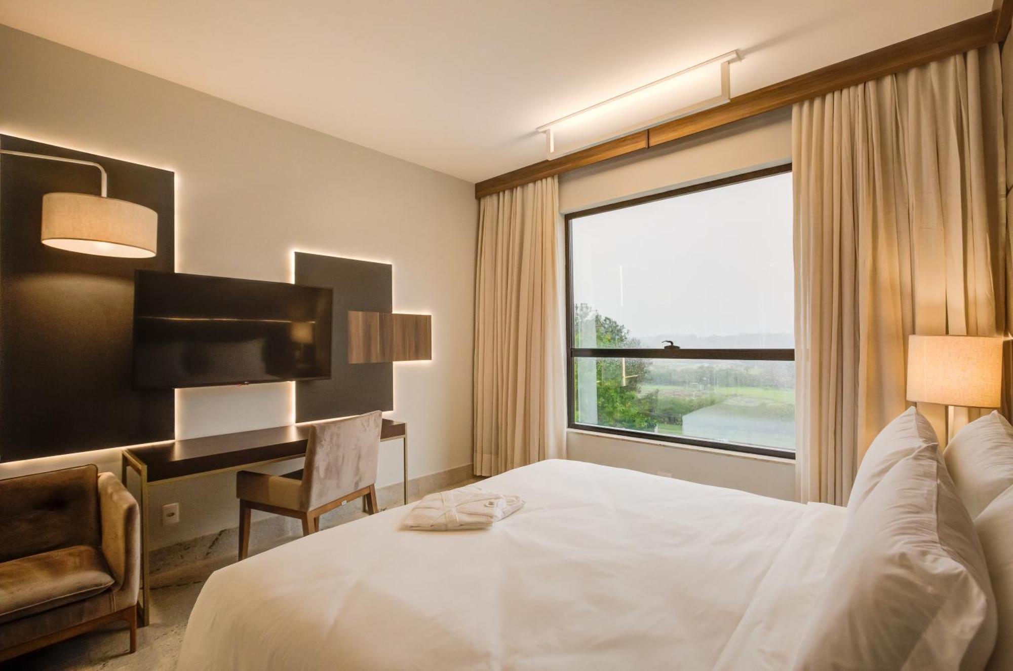 Quarto Deluxe com Vista para a Piscina